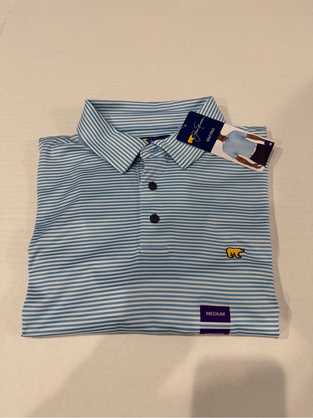 Jack Nicklaus Performance Light Blue & White Striped Polo with Yellow Bear Logo